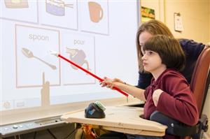 Student using assistive device in classroom 